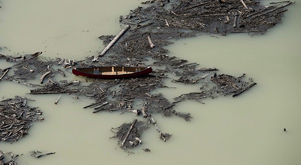 This aerial photo shows the damage caused by a tailings pond breach on Lake Polley, British Columbia. The minister responsible for British Columbia's mines says residents living along waterways affected by a mining-waste spill could catch a lucky break because the waste may not be poisonous. (AP Photo/The Canadian Press: Jonathan Hayward)